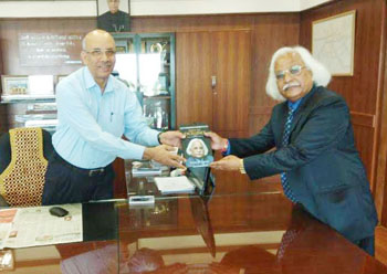Prof P B Sharma presents his book to Metro Man Sreedharan